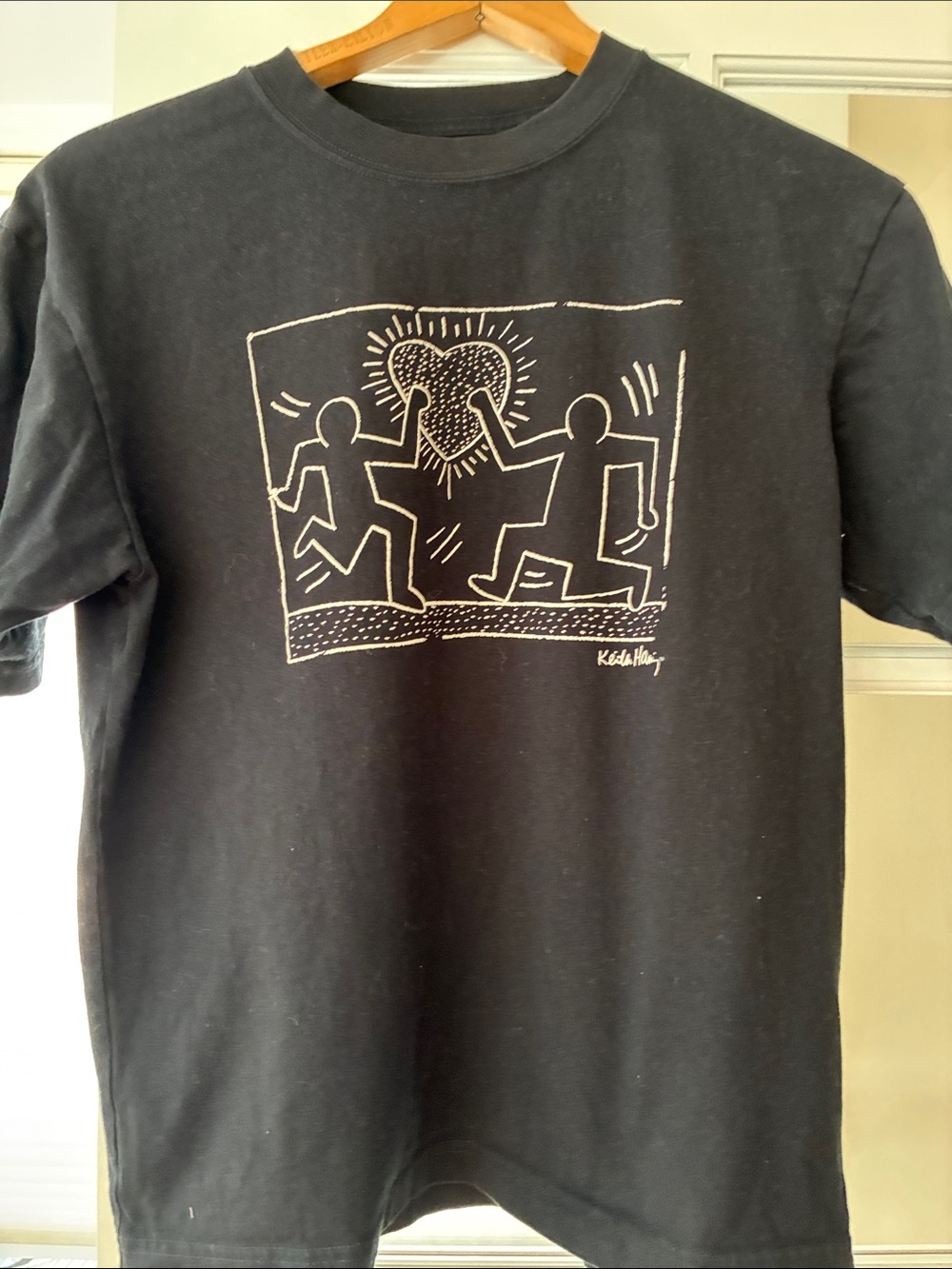 Uniqlo Black Short Sleeve Tee with White Heart Graphic
